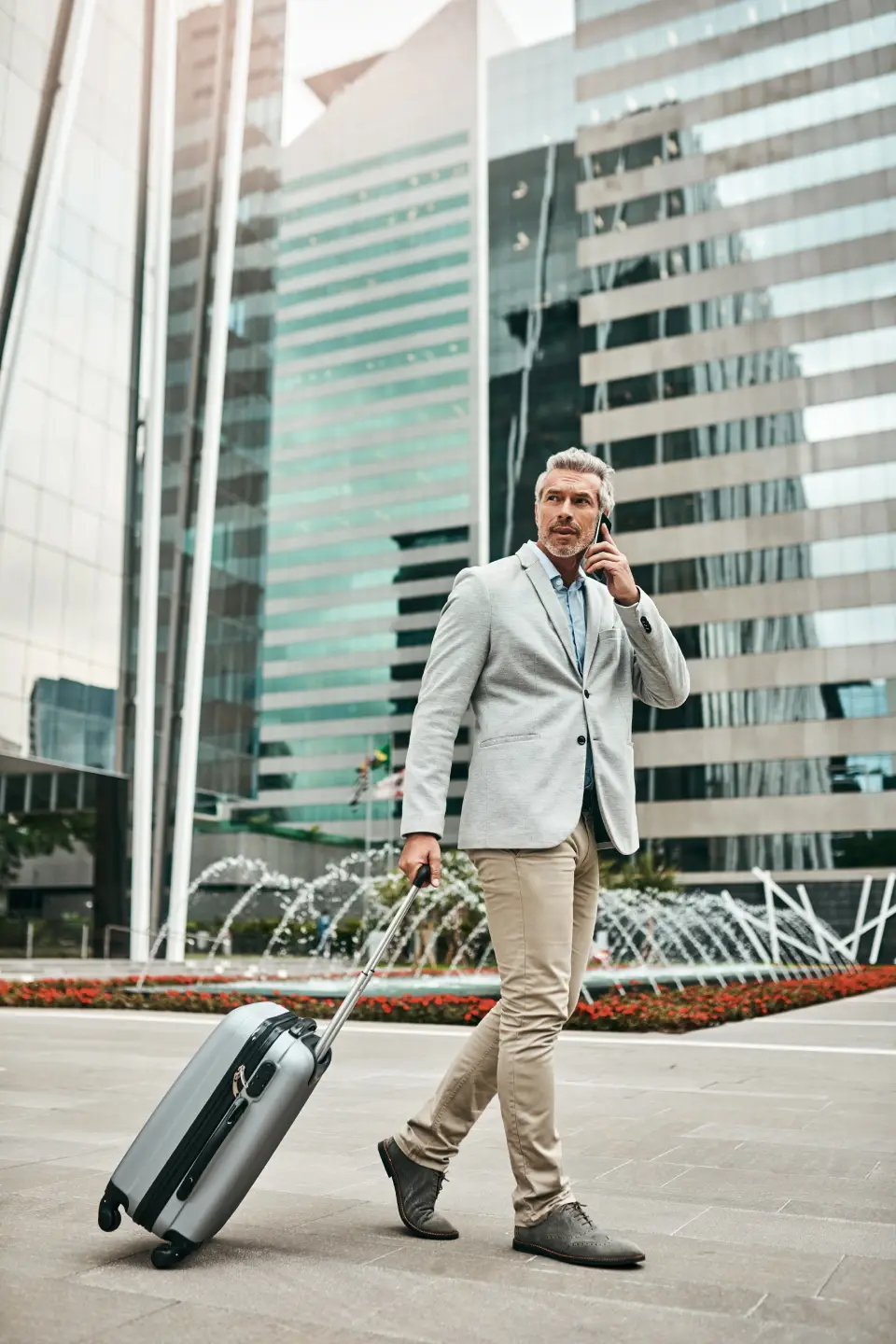 chauffeur greeting travelers at SRQ airport terminal